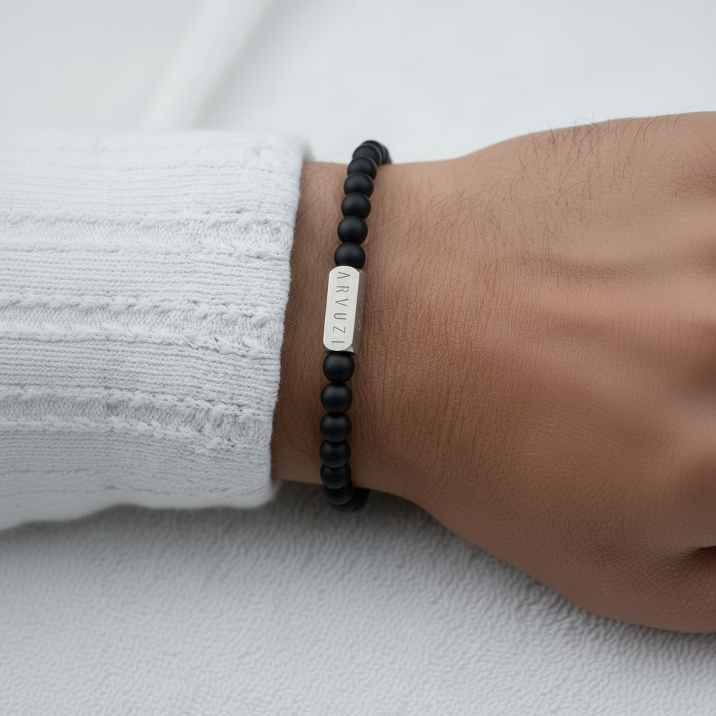 ARVUZI Onyx Noir men’s bracelet – matte black onyx beads – stainless steel clasp – on wrist 2